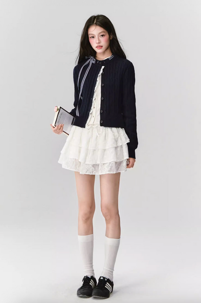 FRENCH CABLE-KNIT BOW CARDIGAN WITH CONTRAST PANELS