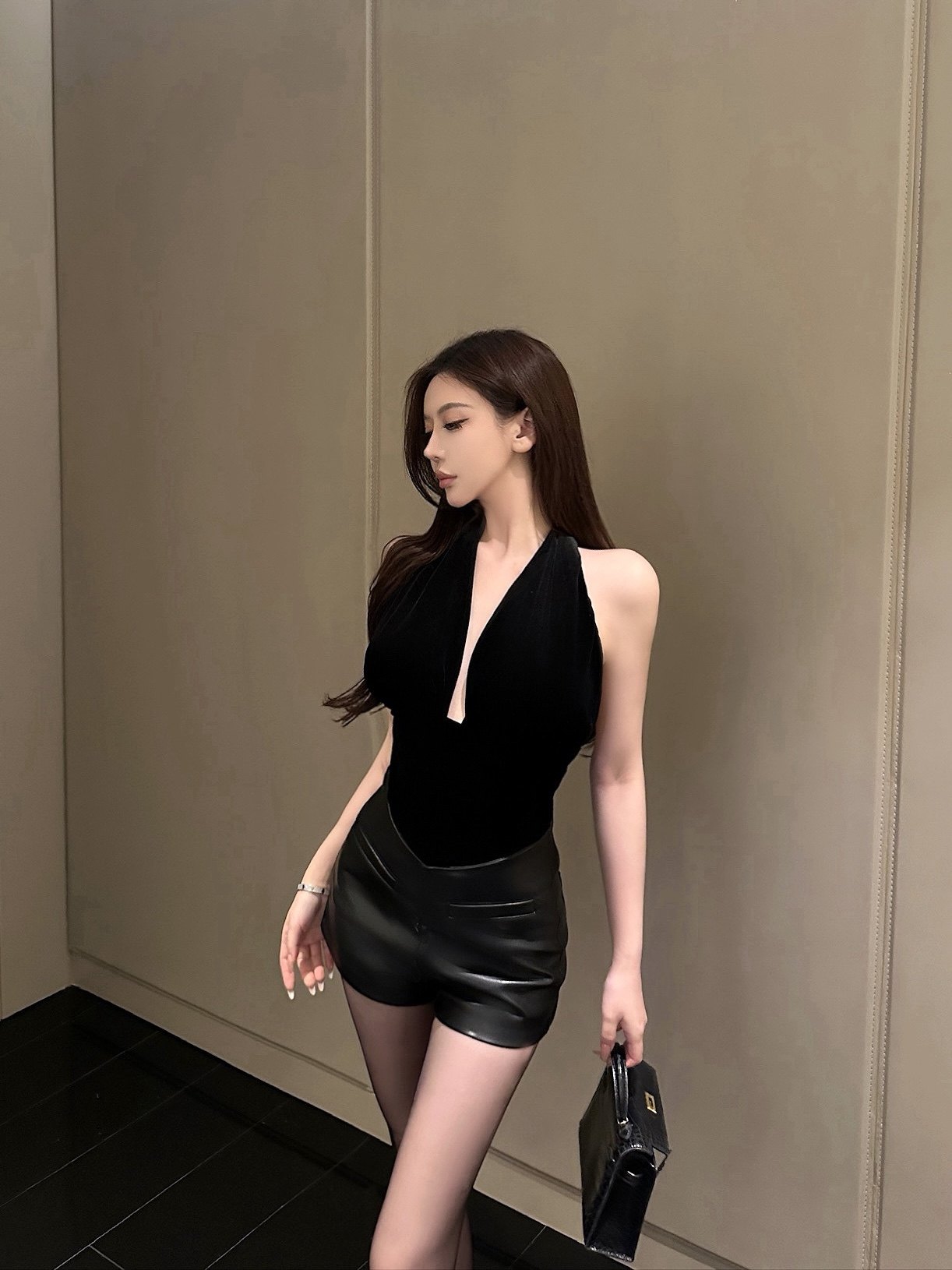 HIGH-WAIST STRETCH LEATHER SHORTS & V-NECK VELVET HALTER TOP