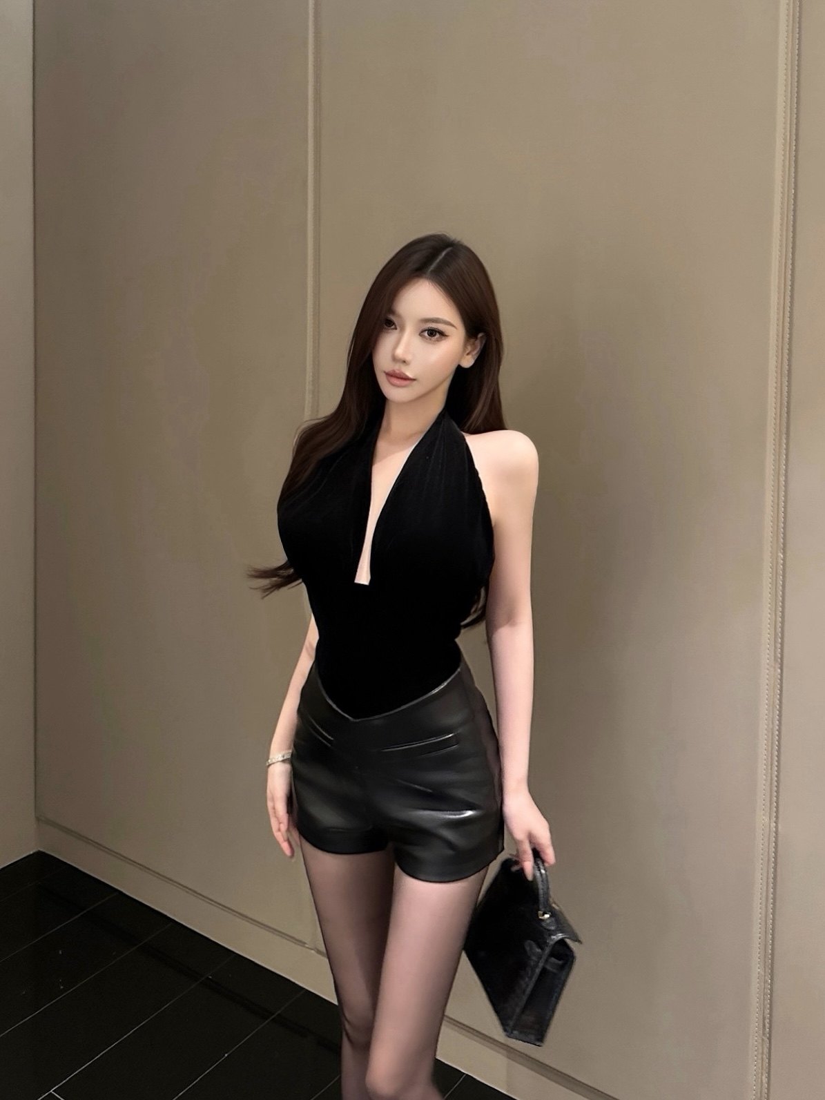 HIGH-WAIST STRETCH LEATHER SHORTS & V-NECK VELVET HALTER TOP